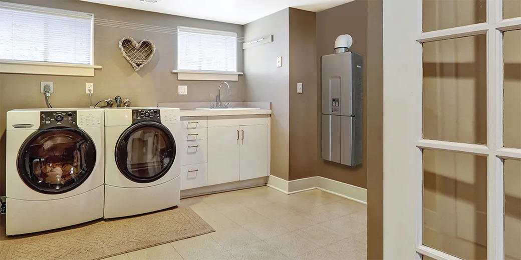 laundry room with a tankless water heater